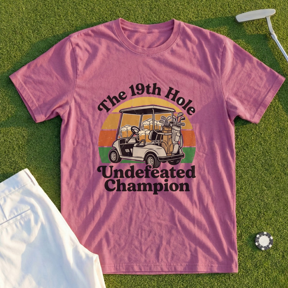 T-shirt with graphic of a golf cart and the text "The 19th Hole: Undefeated Champion."
