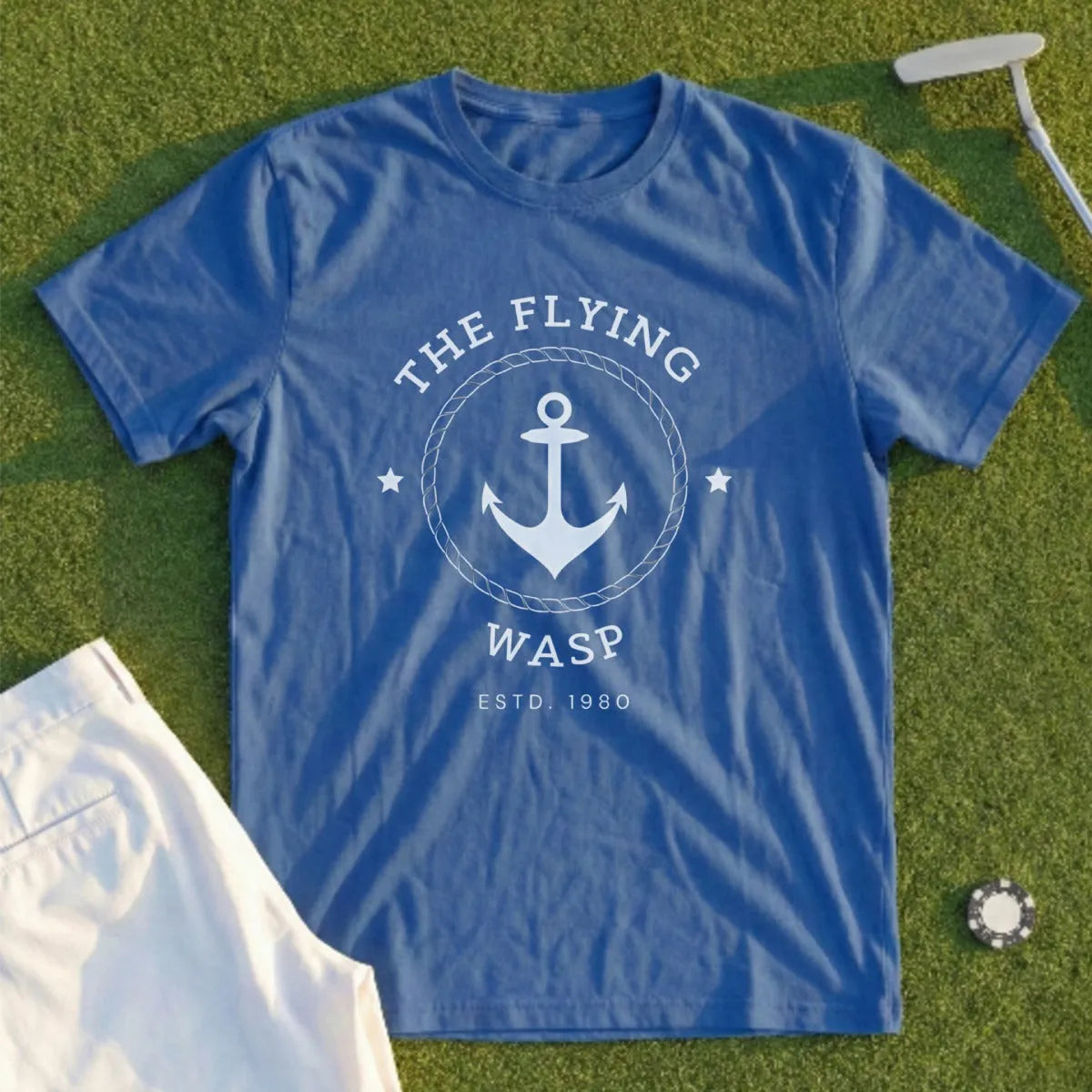 Blue t-shirt with "The Flying Wasp Estd. 1980" anchor logo.