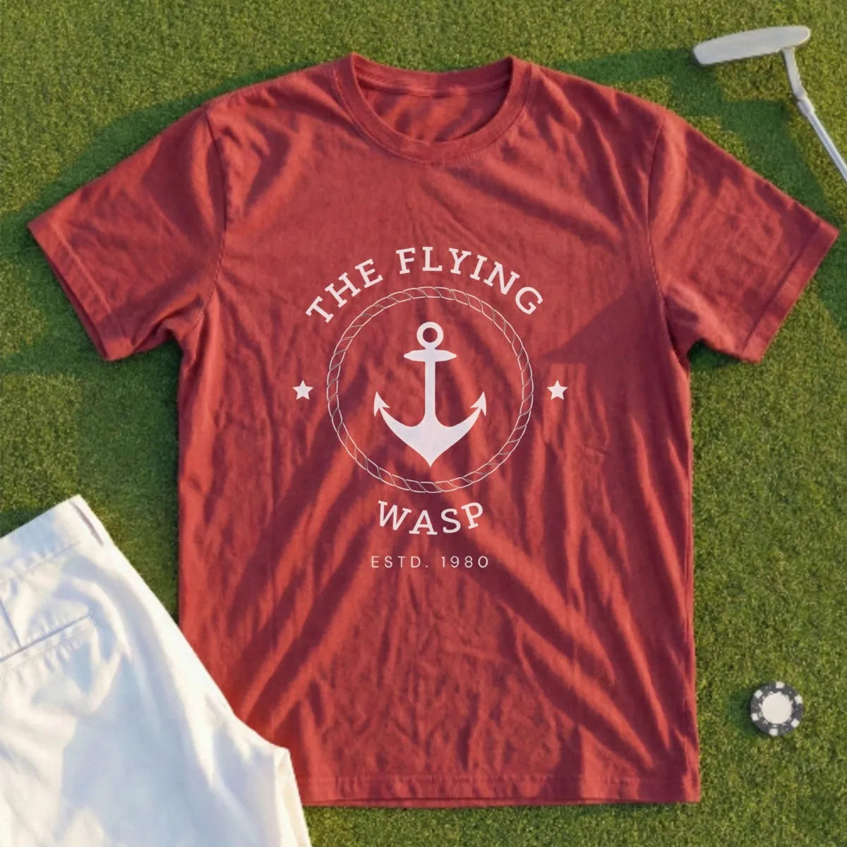 Burgundy t-shirt with "The Flying Wasp" anchor logo and "Est. 1980" text.