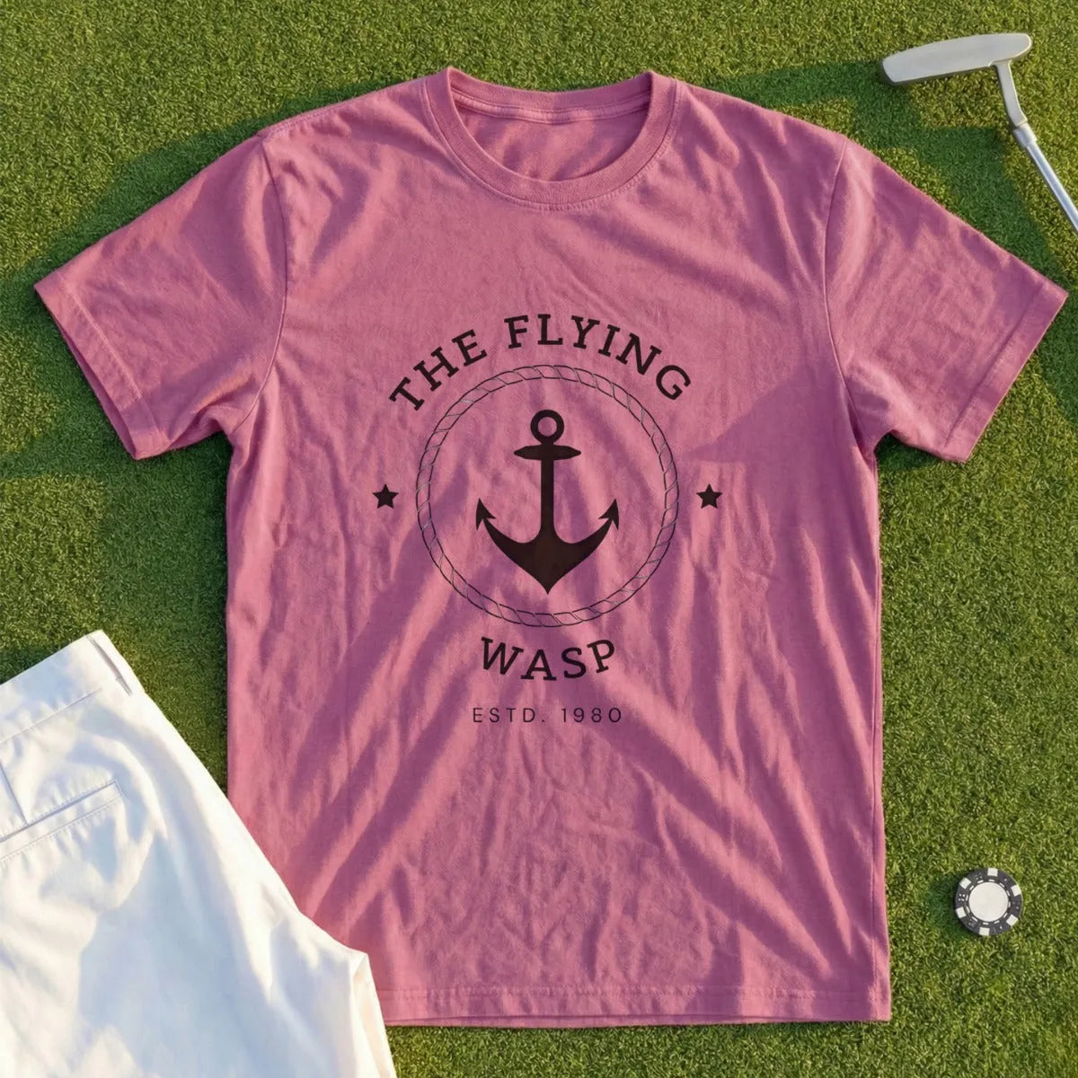 Rose t-shirt with a circular anchor logo and text "The Flying Wasp Estd. 1980".