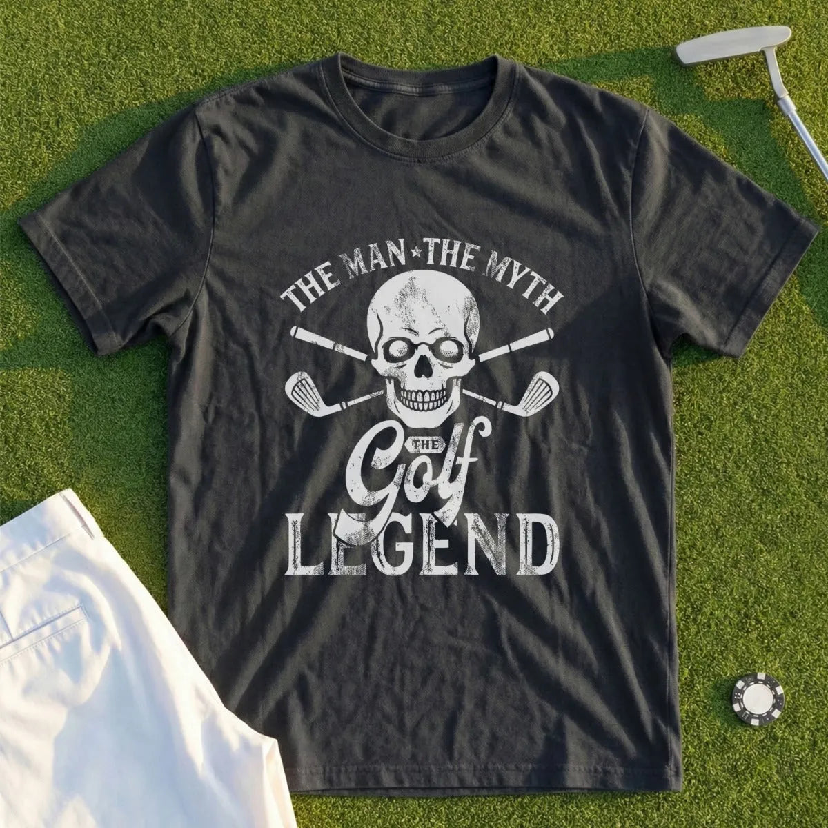 Dark t-shirt with skull, golf clubs, and "The Man The Myth The Golf Legend" text.