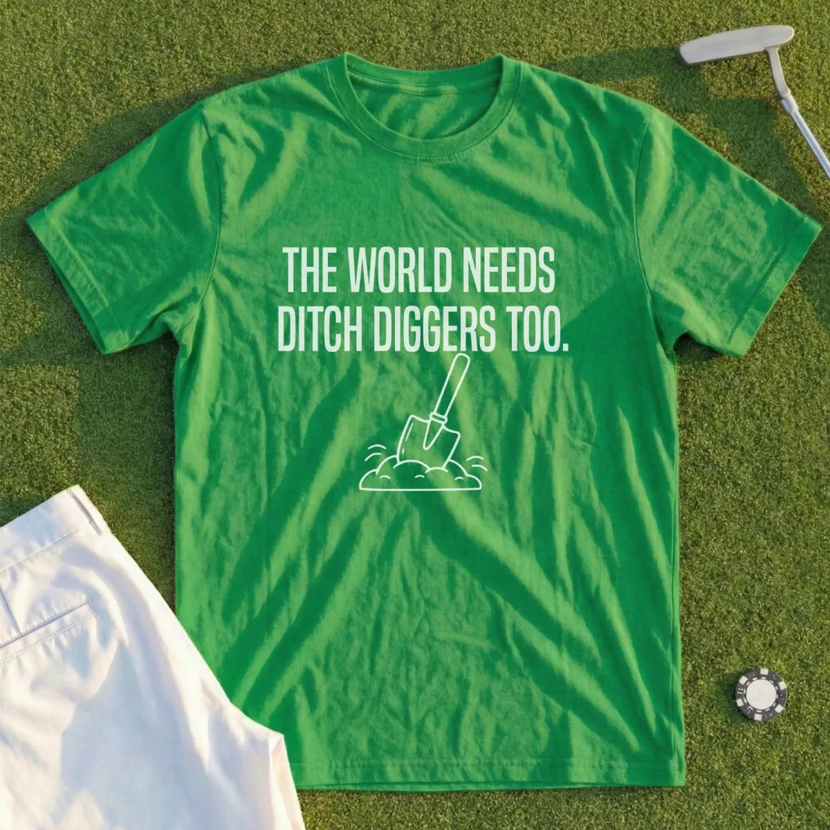 Green t-shirt with "The World Needs Ditch Diggers Too." text and shovel graphic.