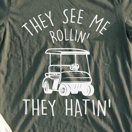 They See Me Rollin Tee, print close-up on Military Green
