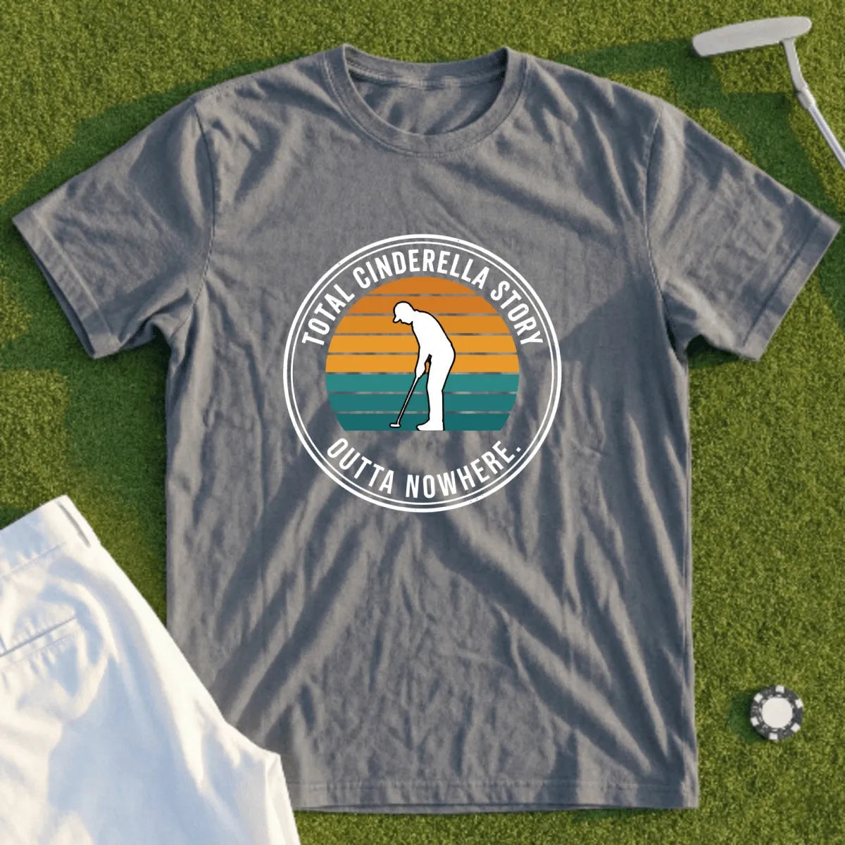 Grey t-shirt with "Cinderella Story Outta Nowhere" text and golfer graphic.