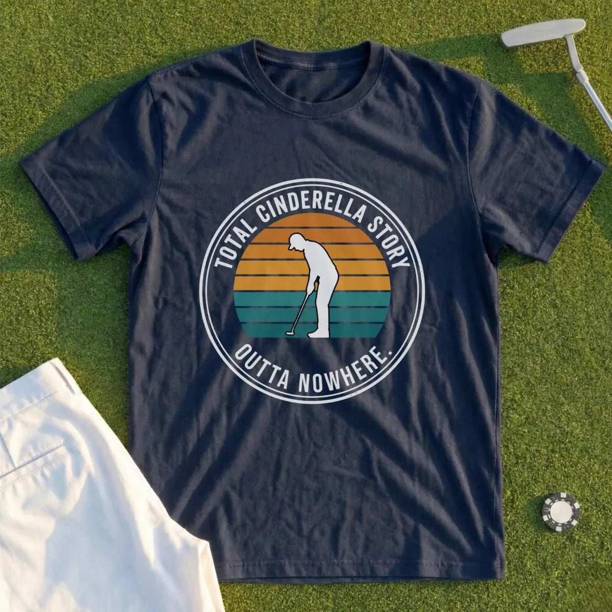 Navy t-shirt with "Total Cinderella Story Outta Nowhere" and a golfer graphic.