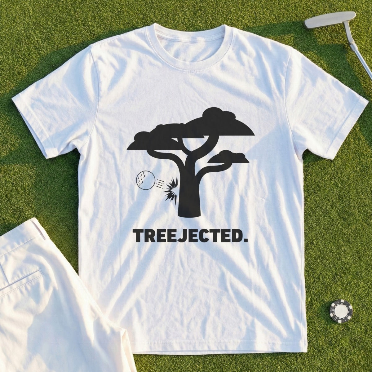White t-shirt with a graphic of a tree, golf ball, and the text "TREEJECTED".