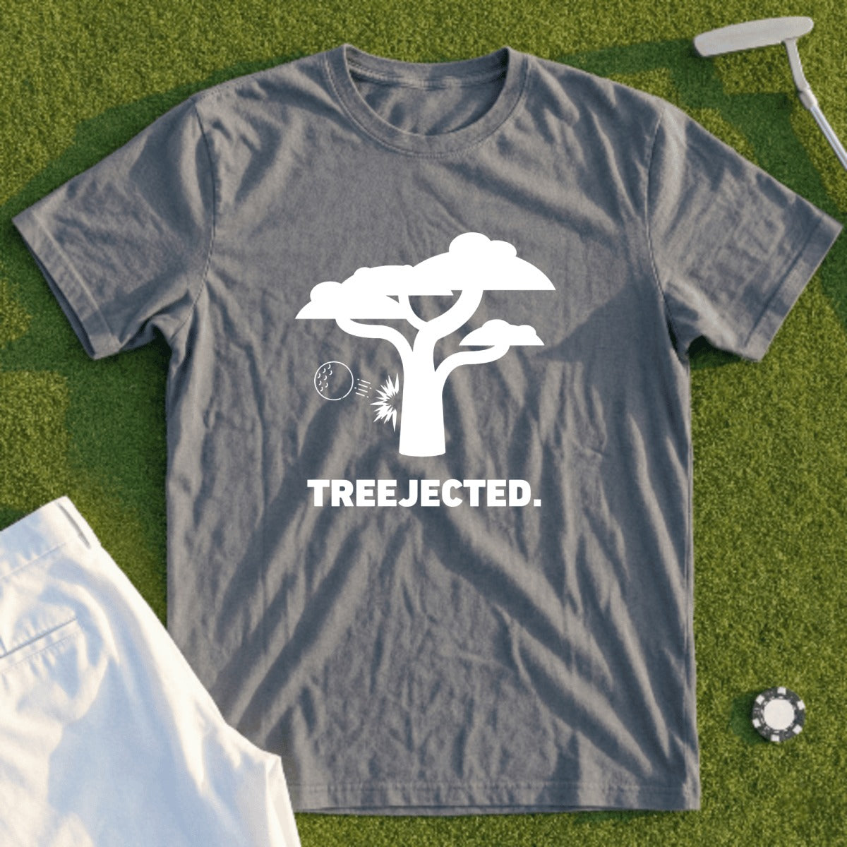 Gray t-shirt with white tree and golf ball graphic, text "TREEJECTED."