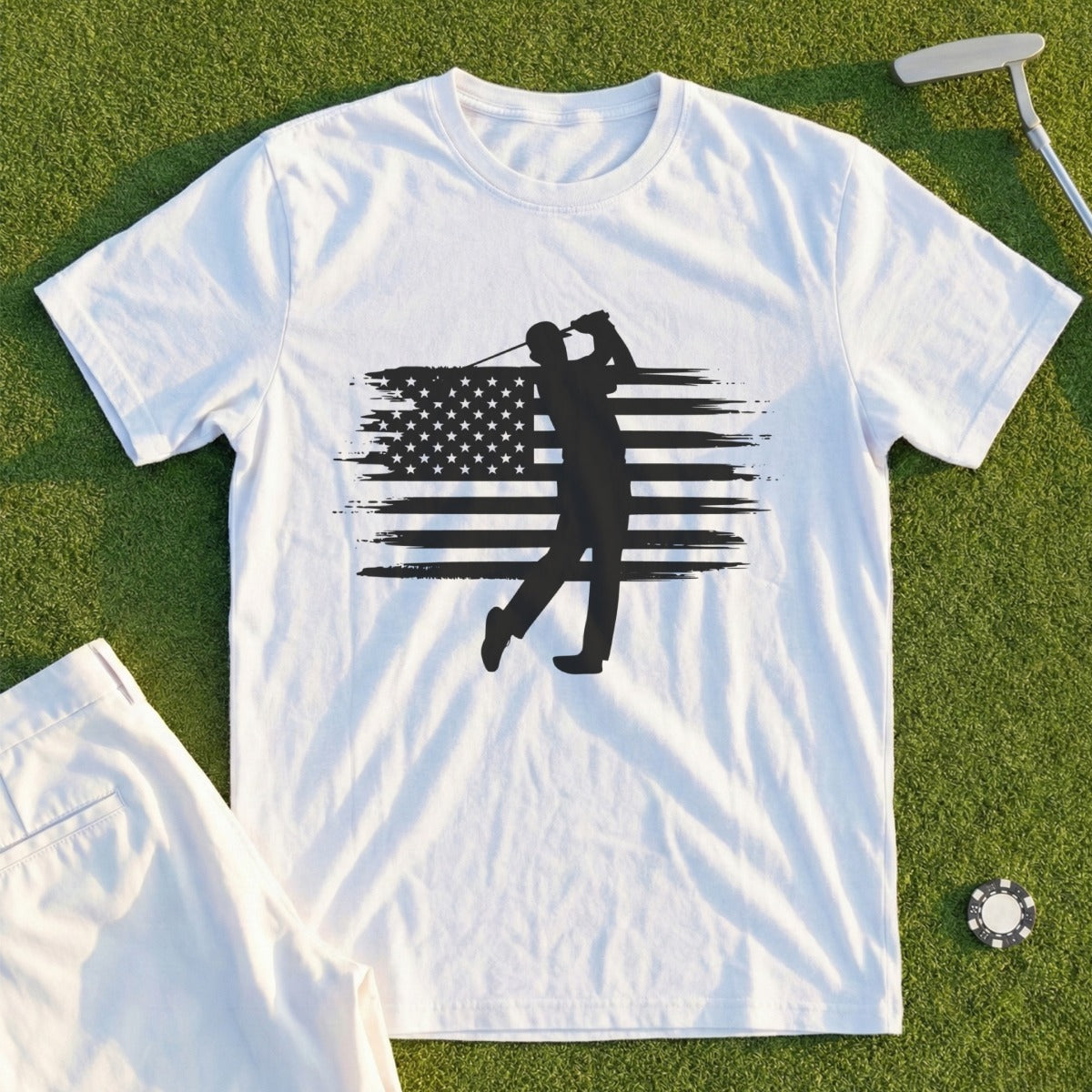 White t-shirt with golfer silhouette on distressed American flag graphic.