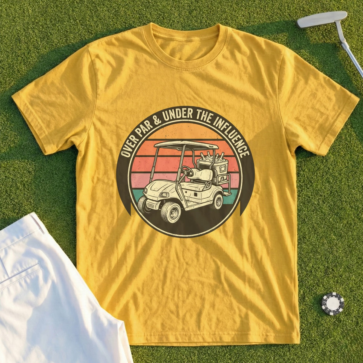 Yellow t-shirt with graphic of golf cart, sunset, and text "Over Par & Under the Influence".