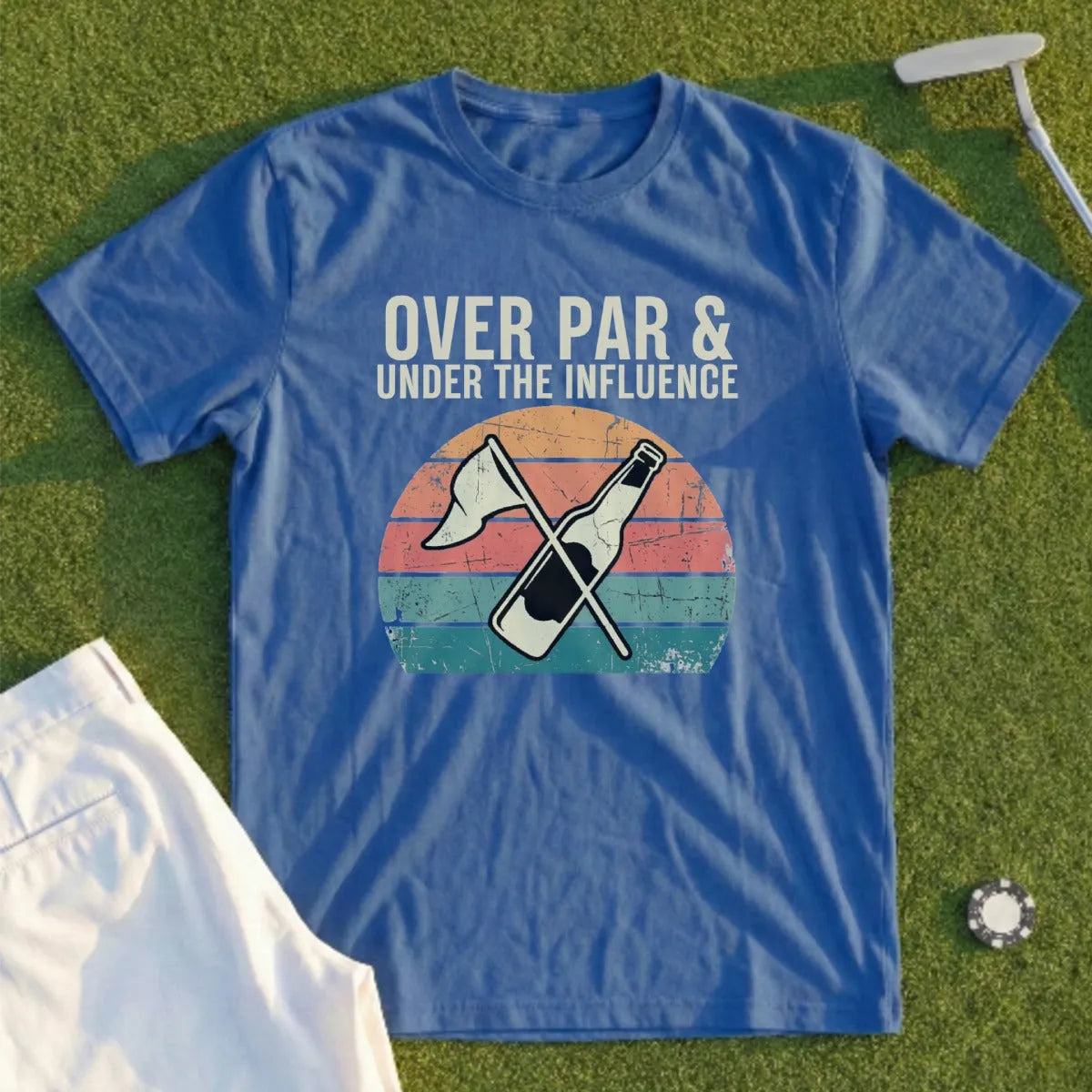 Blue t-shirt with "Over Par & Under The Influence" text and a beer bottle on a golf course.