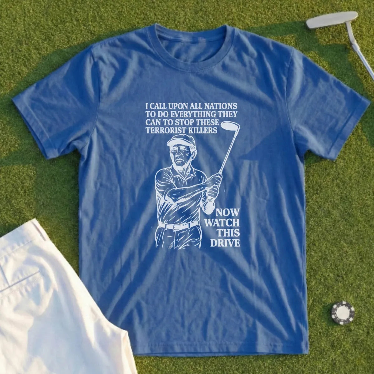 Blue t-shirt with golfer graphic and text: "Now Watch This Drive."