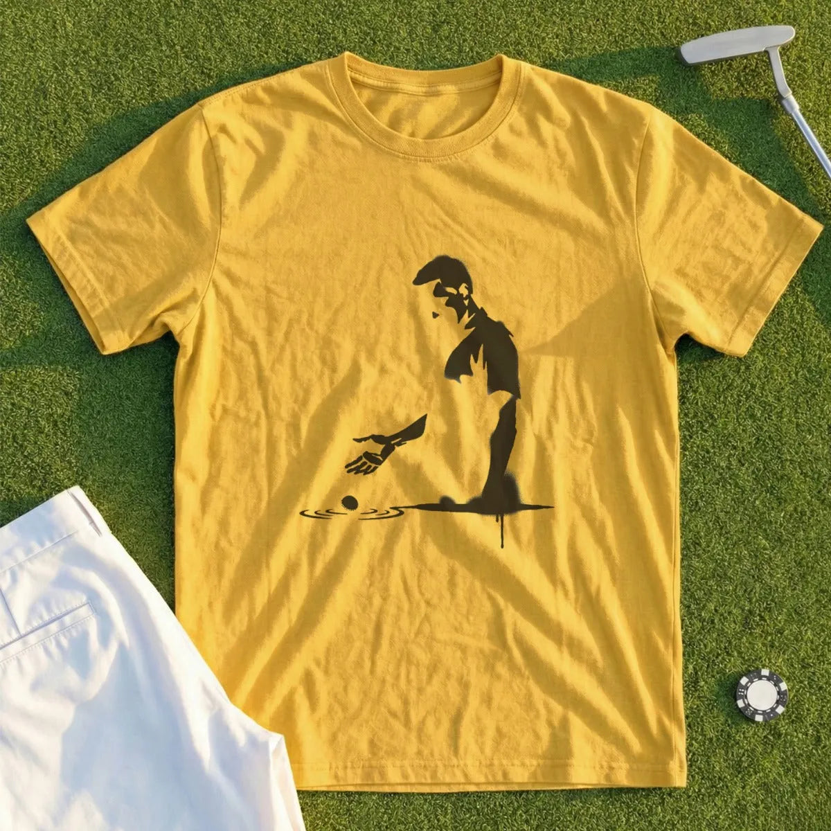 Yellow t-shirt with black silhouette of golfer about to putt.