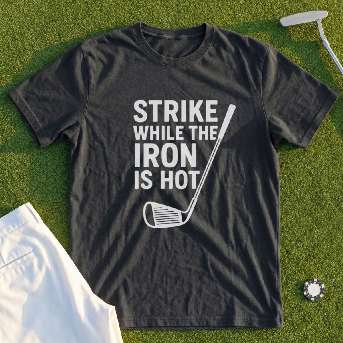 Dark t-shirt with "STRIKE WHILE THE IRON IS HOT" and golf club graphic.