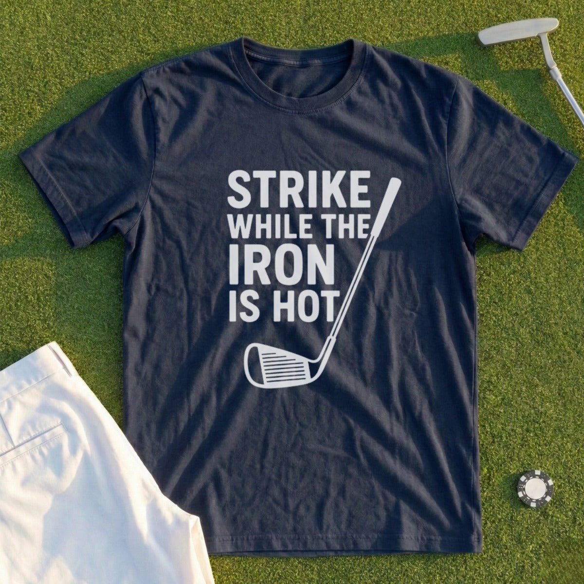 Navy t-shirt with "Strike While The Iron Is Hot" and golf club graphic.