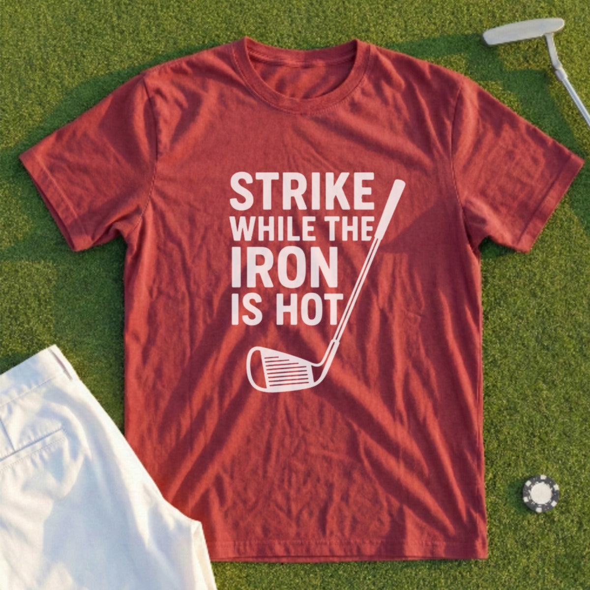 Red t-shirt with "Strike While the Iron is Hot" text and golf club graphic.