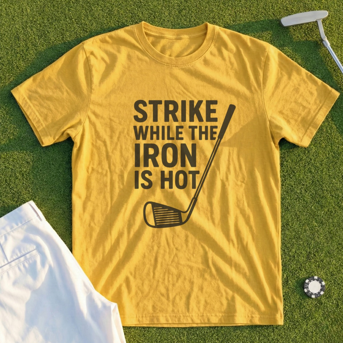 Yellow t-shirt with "Strike While the Iron is Hot" text and golf club graphic.