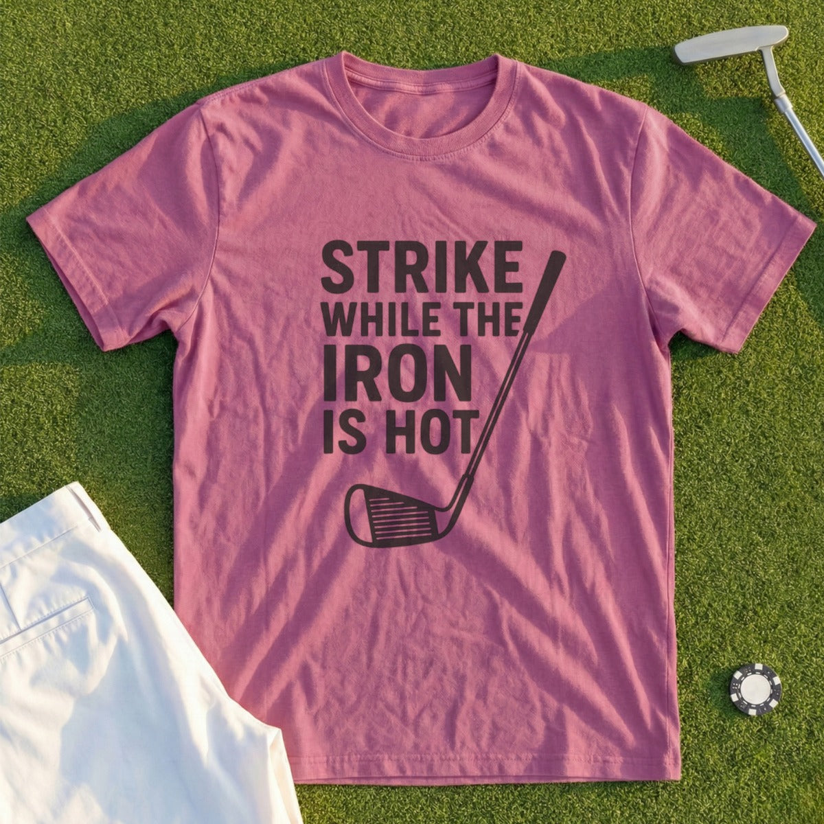 Mauve t-shirt with "Strike While the Iron Is Hot" text and golf club graphic.
