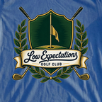 Low Expectations Golf Club Crest Tee, print close-up on Royal