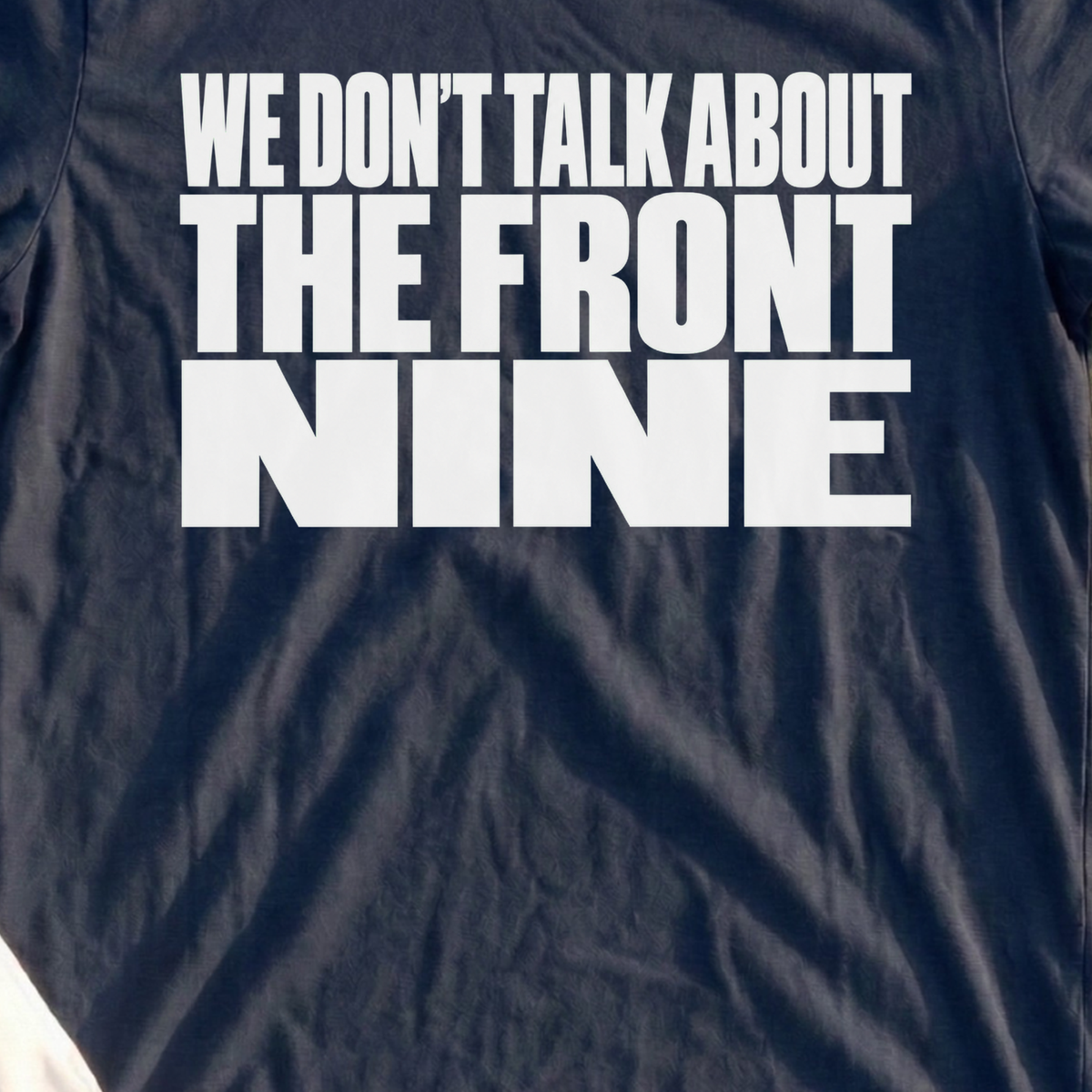 We Don't Talk About The Front Nine Tee, print close-up on Navy
