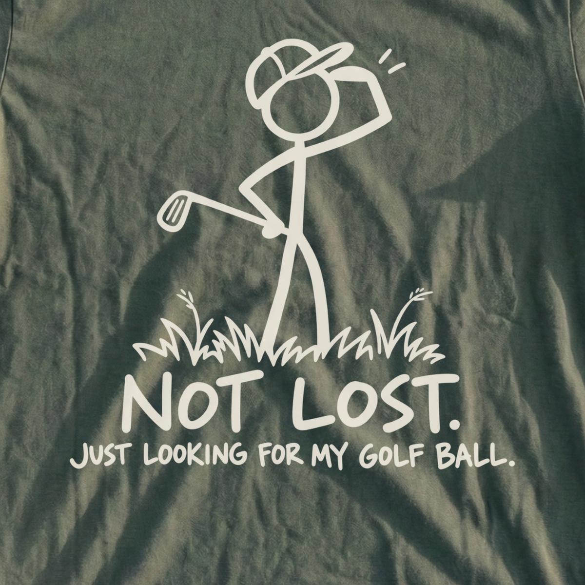 Not Lost Just Looking For My Golf Ball Tee, print close-up on Military Green