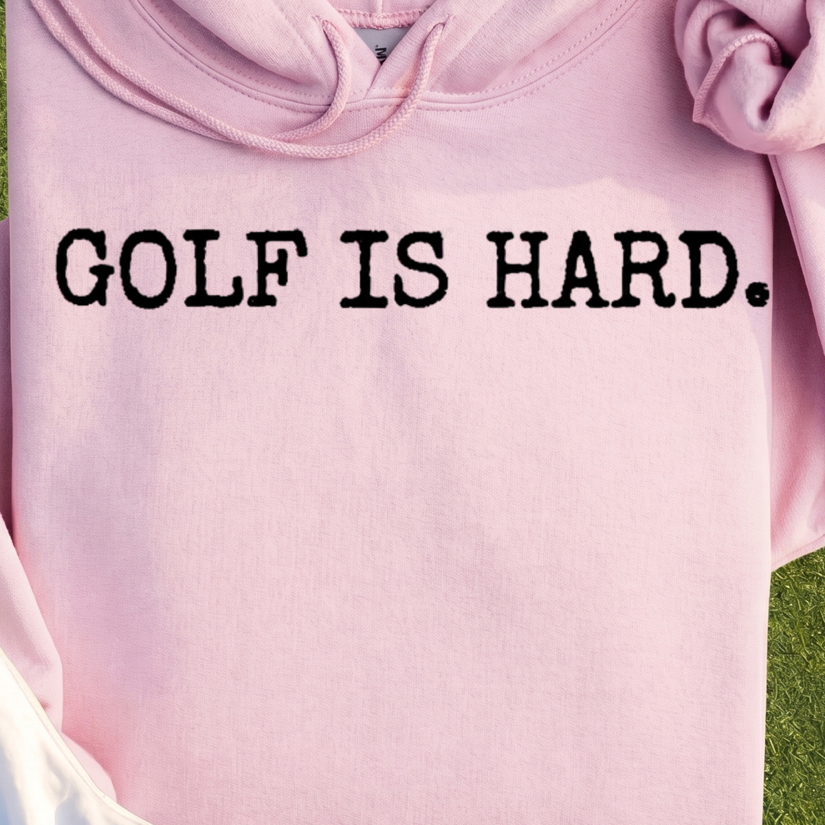 Golf Is Hard Hoodie, print close-up on Light Pink