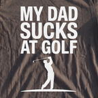 My Dad Sucks At Golf Premium Tee, print close-up on Pepper