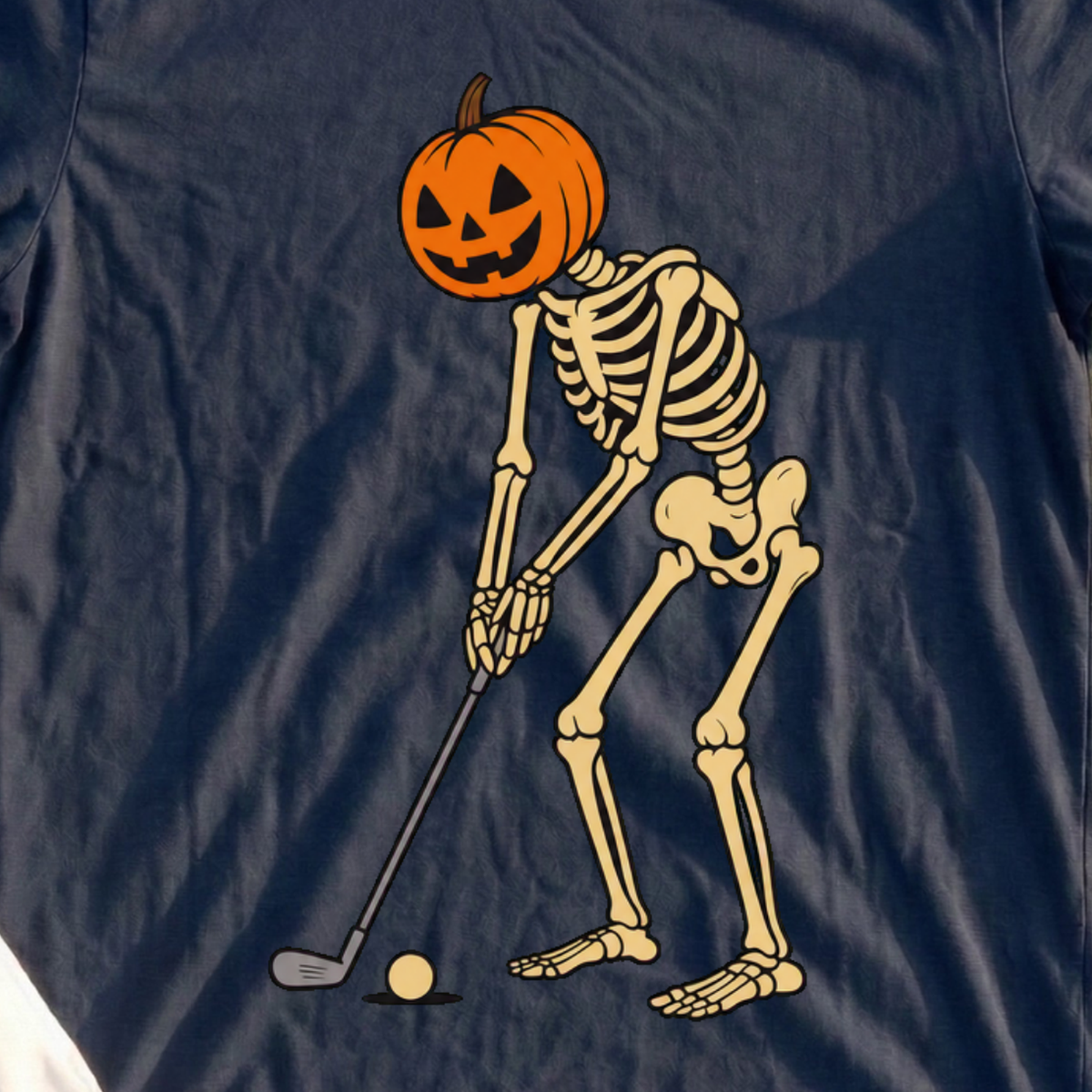 Pumpkin Head Putter Tee, print close-up on Navy