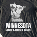 Minnesota Land Of 10000 Water Hazards Tee, print close-up on Black
