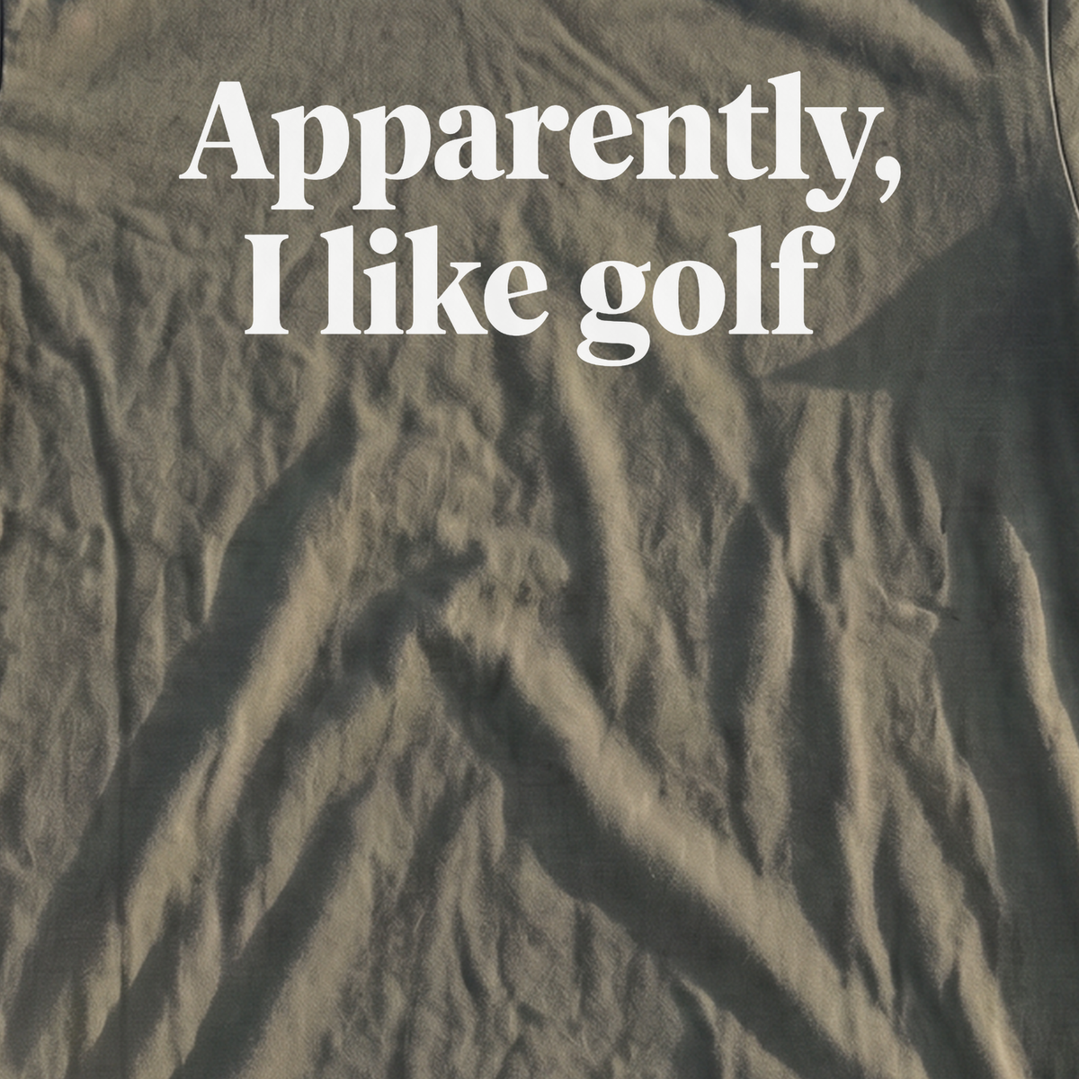 Apparently I Like Golf Premium Tee, print close-up on Moss