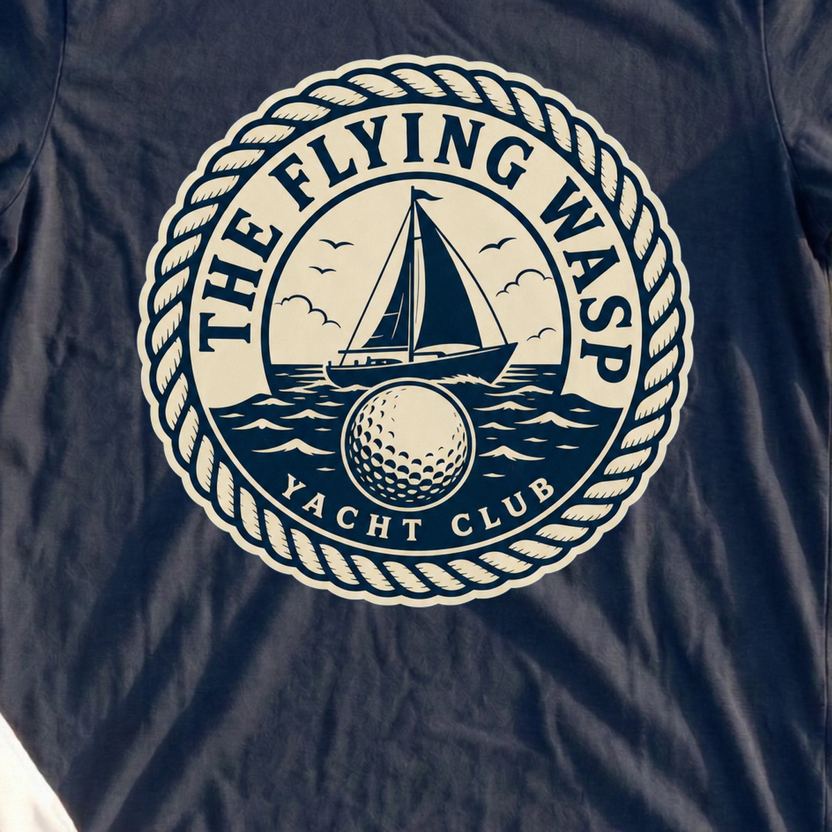 The Wasp Yacht Club Crest. Tee, print close-up on Navy