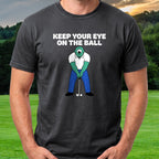 Keep Your Eye On The Ball Tee worn on the golf course, Black