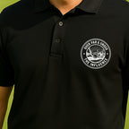 Over Par & Under The Influence Performance Polo worn on the golf course, Black