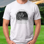 Wandering Sasquatch Trail Cam Tee worn on the golf course, White