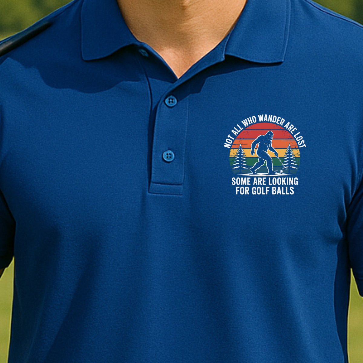 Wandering Sasquatch Performance Polo worn on the golf course, Royal