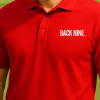 Back Nine Performance Polo worn on the golf course, Red
