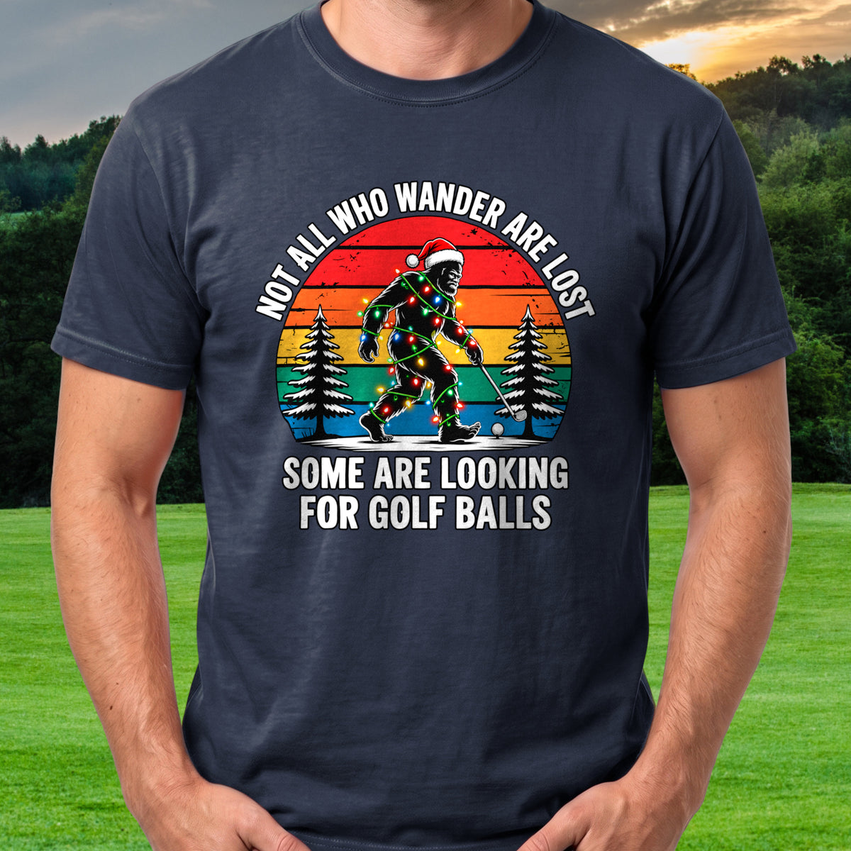 Wandering Sasquatch Christmas Lights Tee worn on the golf course, Navy